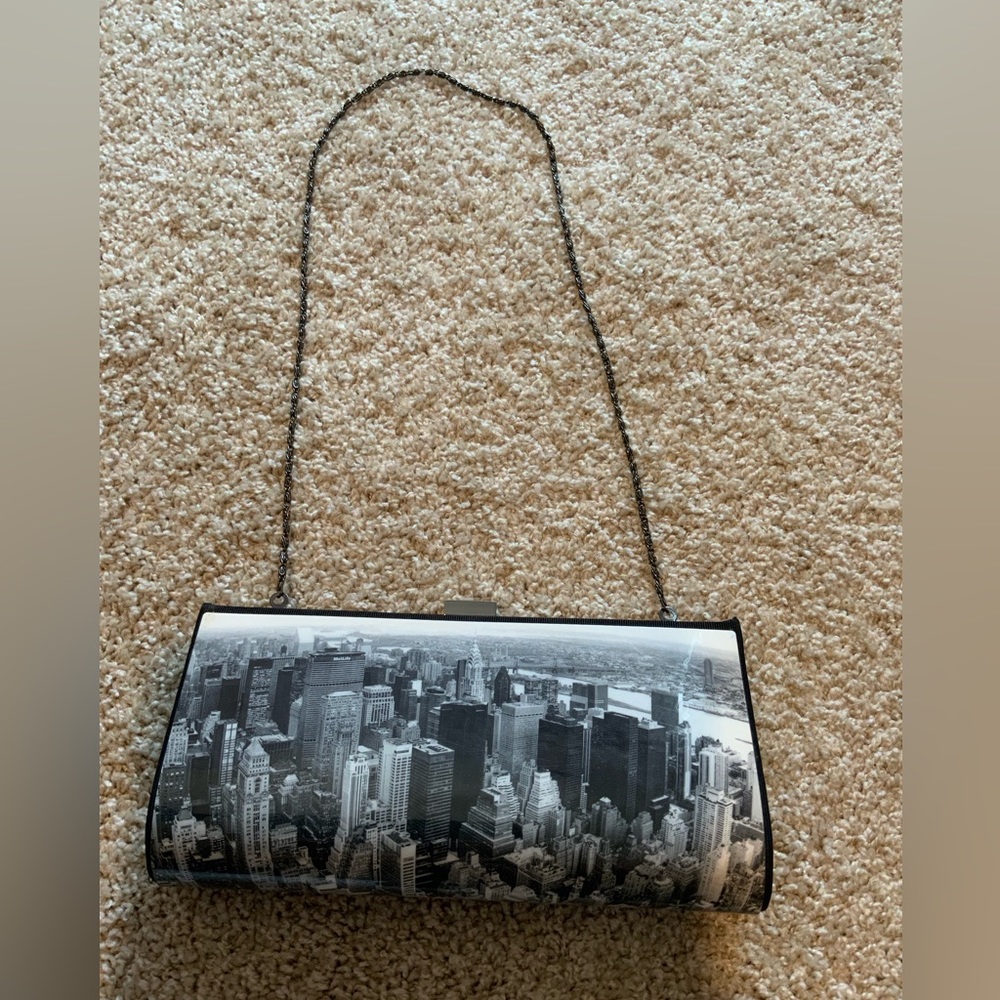 Retro city scene purse can be worn as a clutch or shoulder bag.